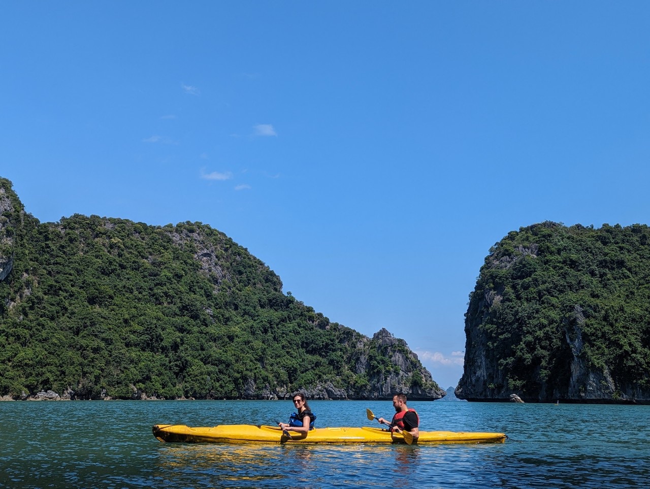 Kayaking in Lan Ha Bay with stunning limestone karsts and clear waters, perfect for a peaceful day e.