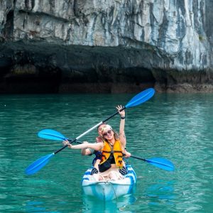 kayaking-happy-couple-emerald-water-grand-pioneers-cruise-halong-bay-viettrendtour