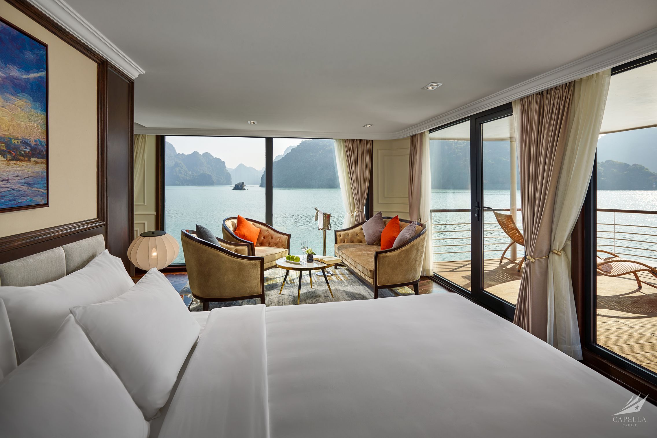 Stunning luxury hotel room with balcony overlooking Halong Bay, Vietnam.