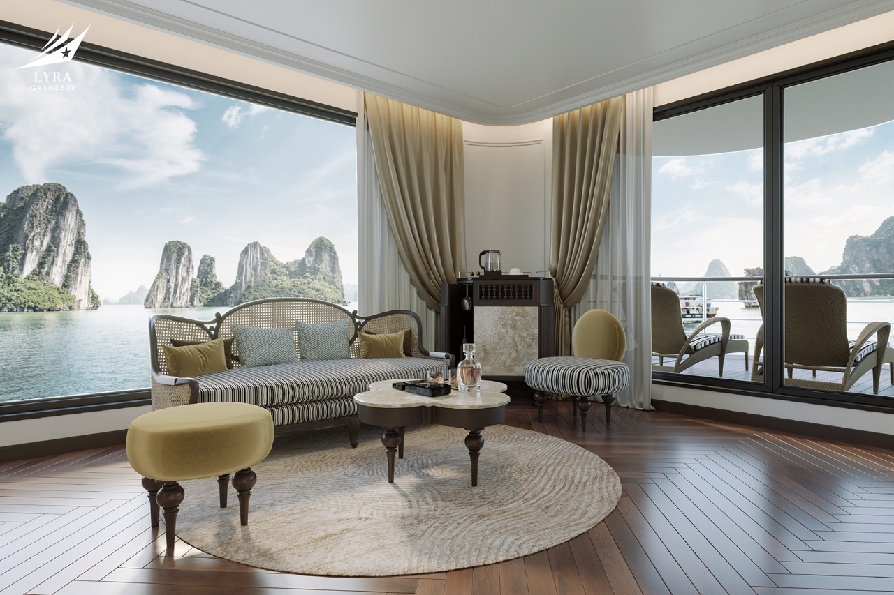 Luxury harbor view hotel suite with panoramic windows overlooking limestone islands, elegant furniture, and stylish decor.