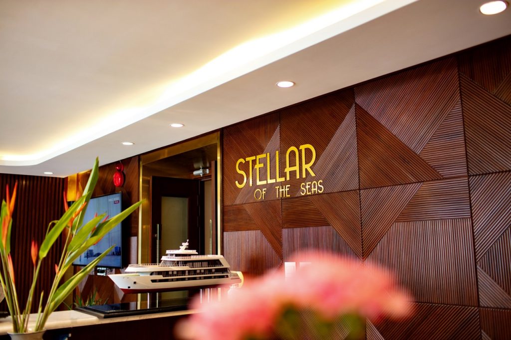 Luxury yacht model displayed at Stellar of the Seas hotel lobby, Vietnam travel and cruise experience.