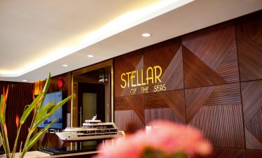 Luxury yacht model displayed at Stellar of the Seas hotel lobby, Vietnam travel and cruise experience.