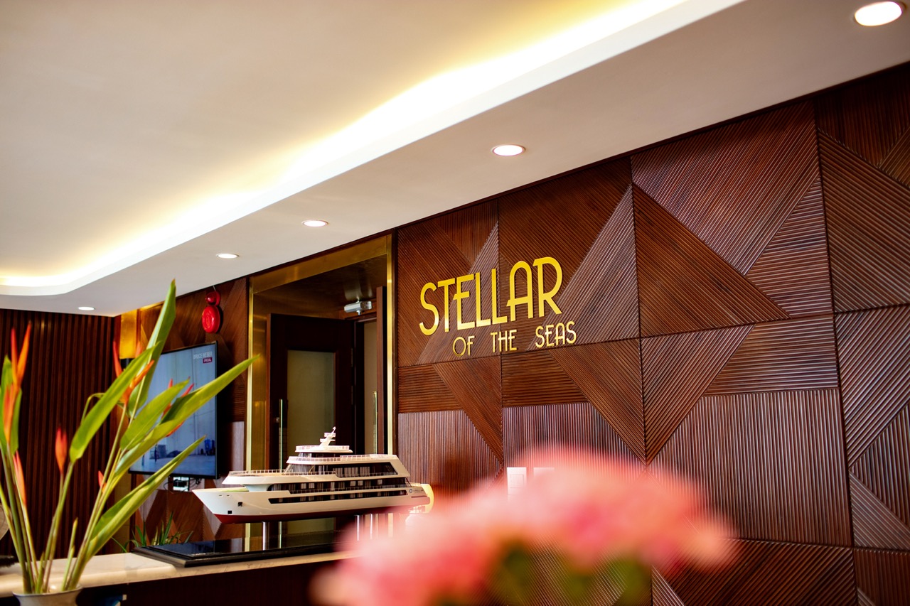 Luxury yacht model displayed at Stellar of the Seas hotel lobby, Vietnam travel and cruise experience.