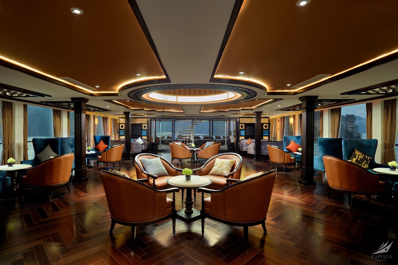 Elegant cruise lounge with luxurious seating and panoramic views.