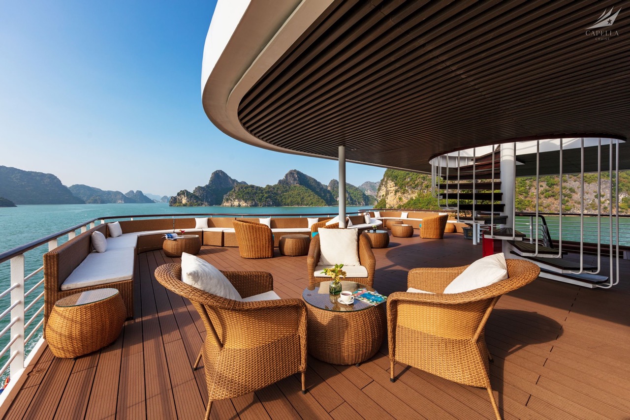 Relaxing deck on luxurious boat with scenic bay view, perfect for tropical cruise vacation SEO.