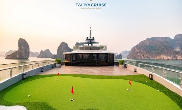Stunning view from the cruise balcony over Halong Bay's emerald waters and limestone karsts.