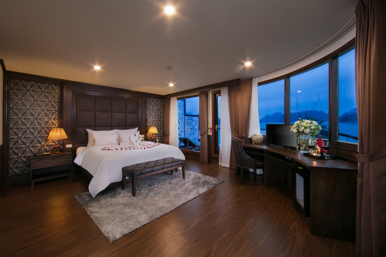 Elegant cruise balcony view of Halong Bay with serene waters and lush islands, perfect for a romanti.