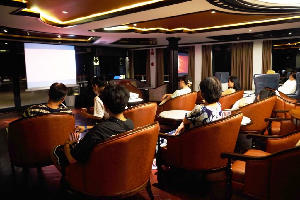 Relaxed movie screening in a cozy luxury theater room, perfect for private events and group entertainment.