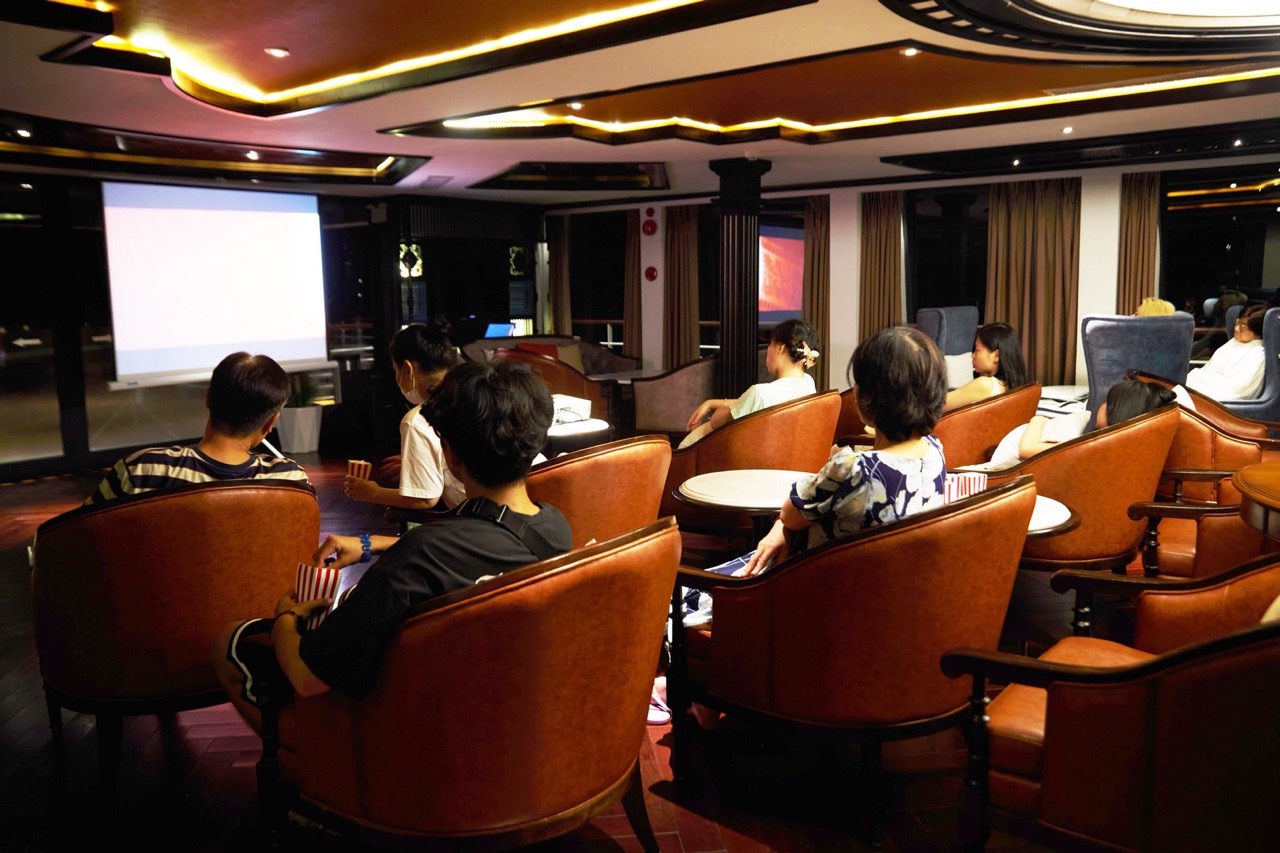 Relaxed movie screening in a cozy luxury theater room, perfect for private events and group entertainment.