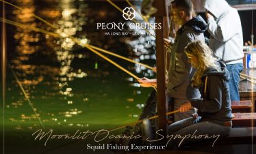 Enjoying night fishing on Halong Bay cruise balcony with friends.