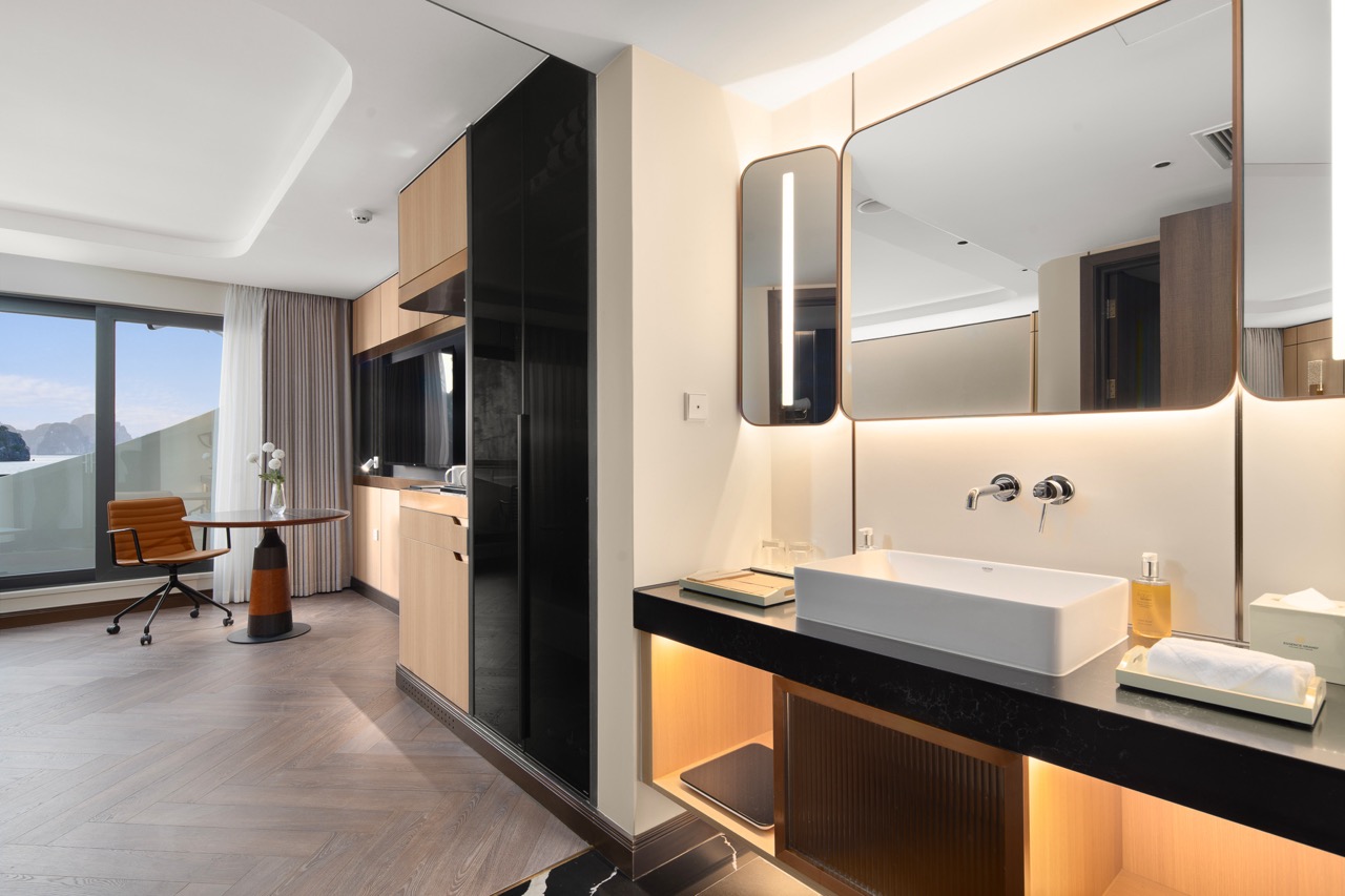 Modern hotel room with stylish interior and sea view window, perfect for luxury travel in Vietnam.