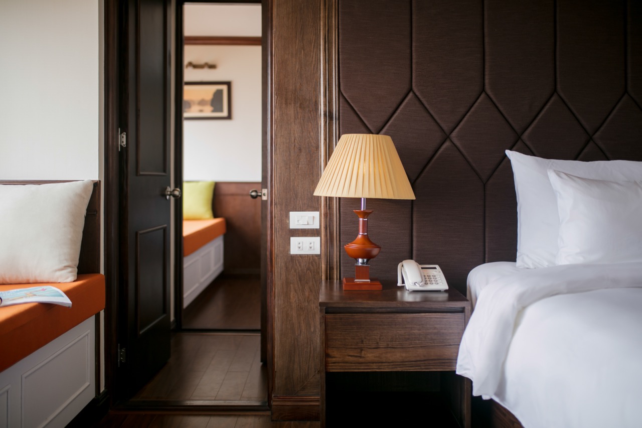 Elegant cruise room with modern decor and scenic views of Halong Bay. Perfect for a memorable 2D1N v.