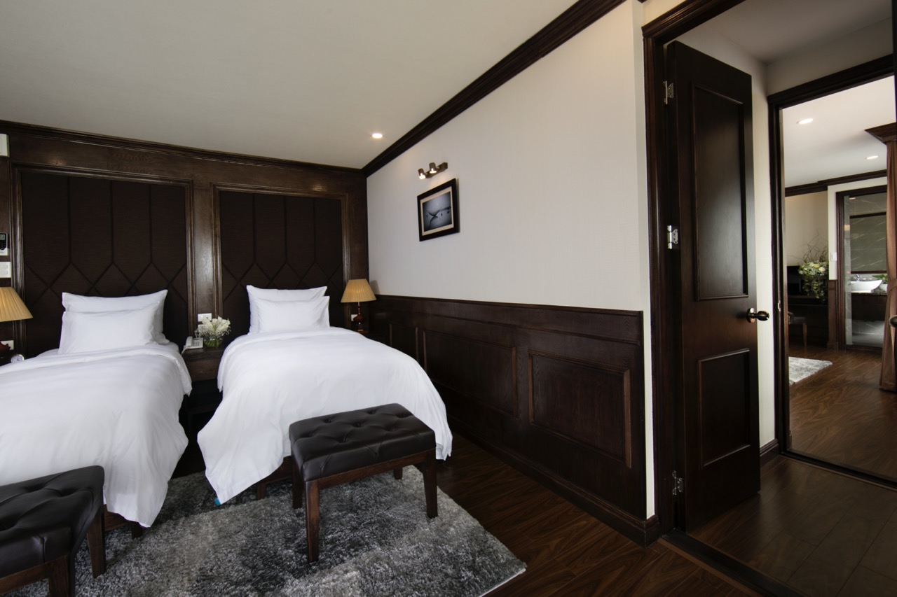 Comfortable cruise balcony view of Halong Bay with elegant interior design.