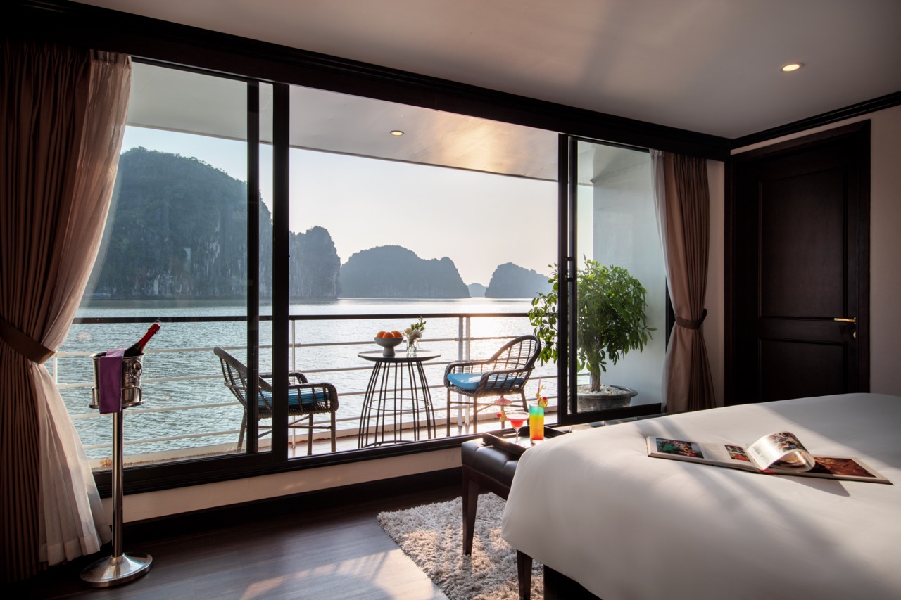 Stunning view of Halong Bay from a luxury cruise balcony, perfect for relaxing and enjoying the scen.