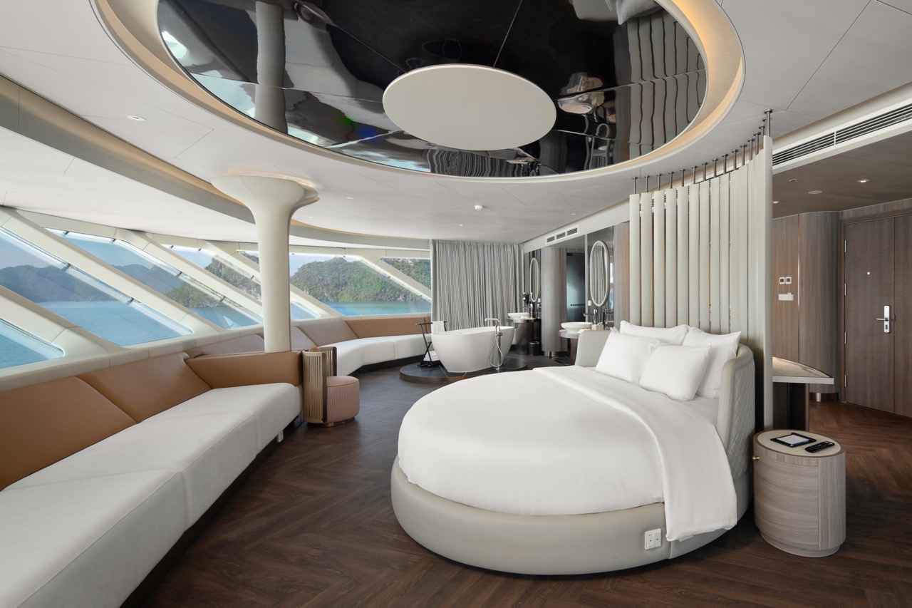 Luxurious modern cruise ship bedroom with ocean views and elegant interior design.