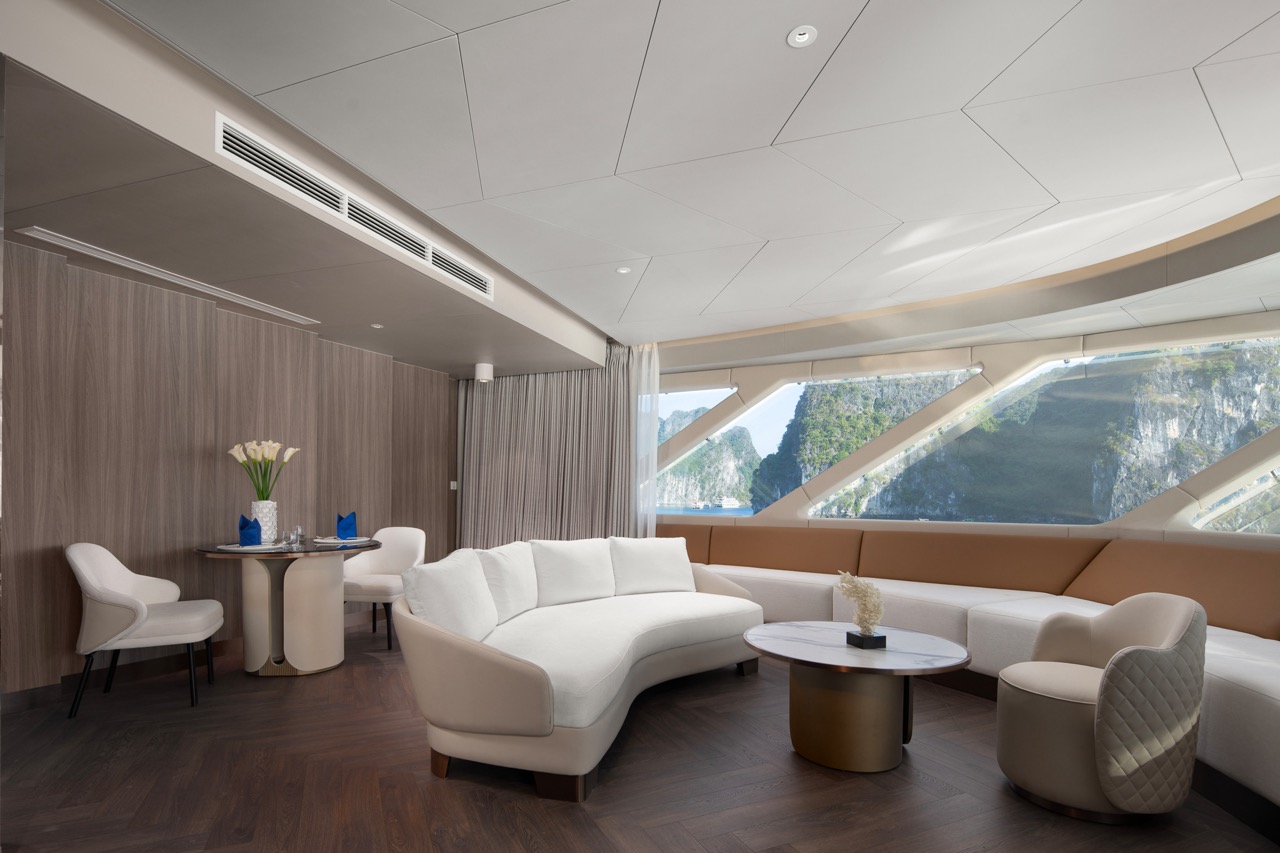 Luxury cruise lounge with panoramic views, modern furniture, and elegant decor.
