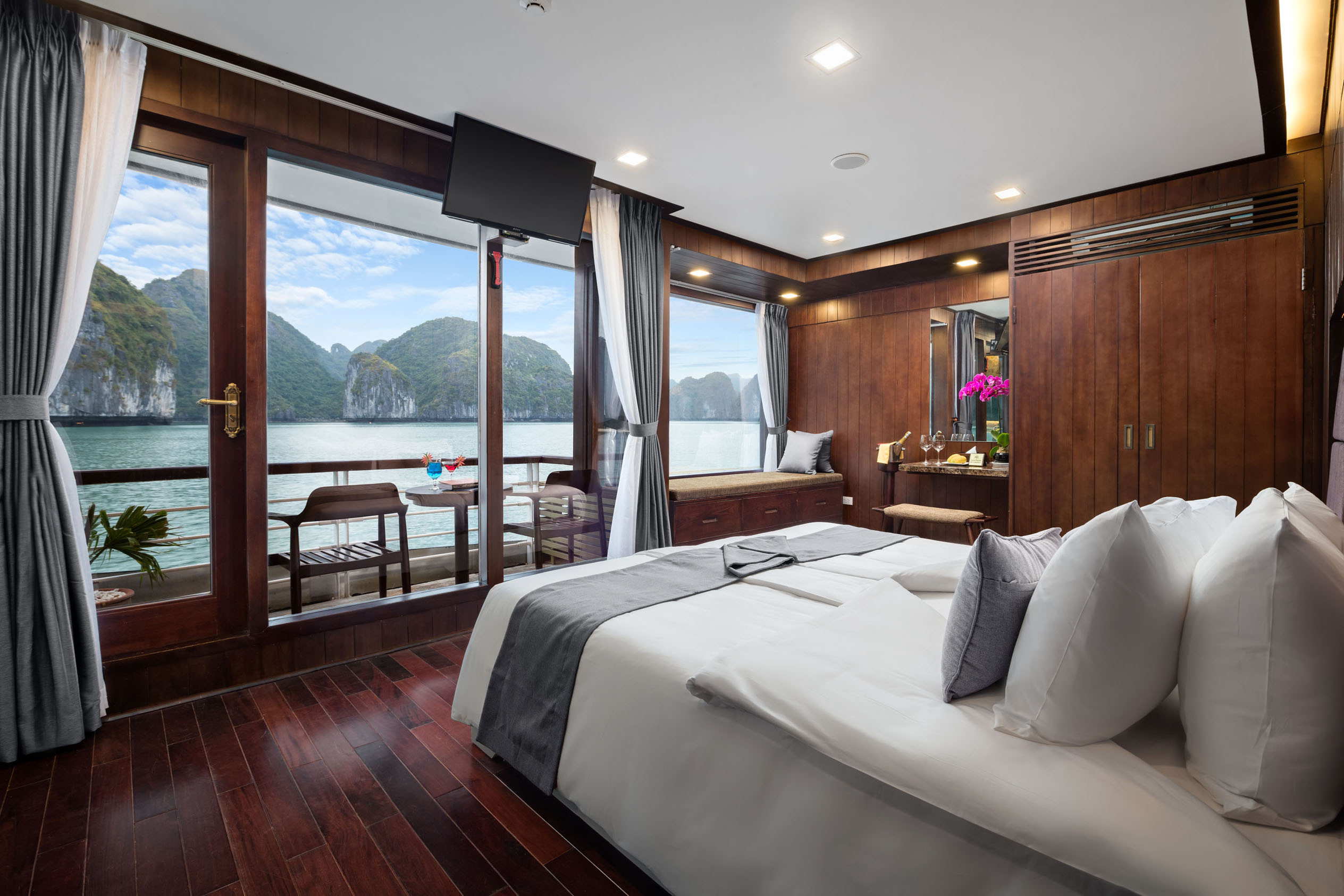 Overwater luxury hotel room with stunning bay view and modern amenities in Vietnam.