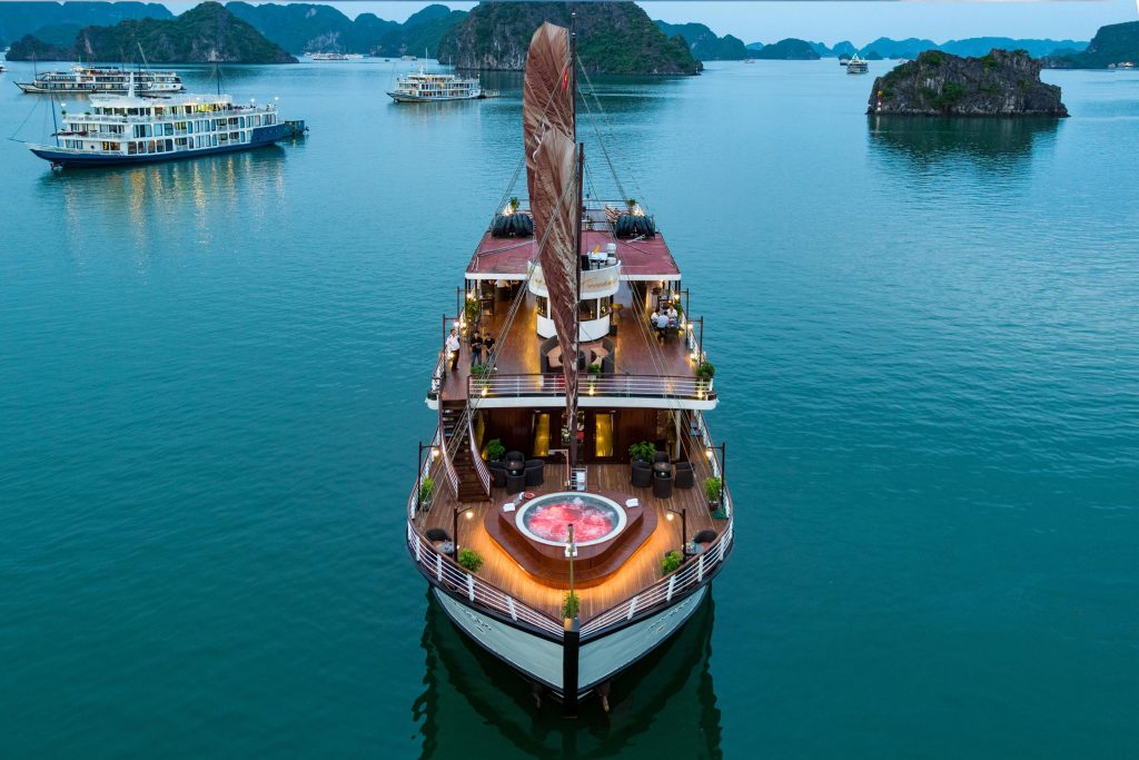 Orchid classic cruise halong bay - elegant cruise ship sailing in Halong Bay with stunning limestone islands.