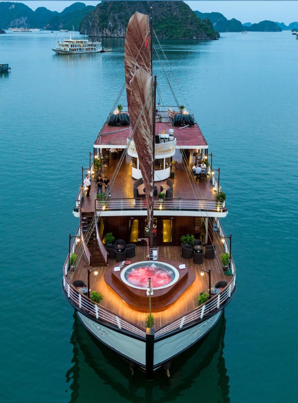 Orchid classic cruise halong bay - elegant cruise ship sailing in Halong Bay with stunning limestone islands.