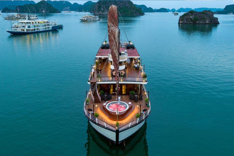 Orchid classic cruise halong bay - elegant cruise ship sailing in Halong Bay with stunning limestone islands.
