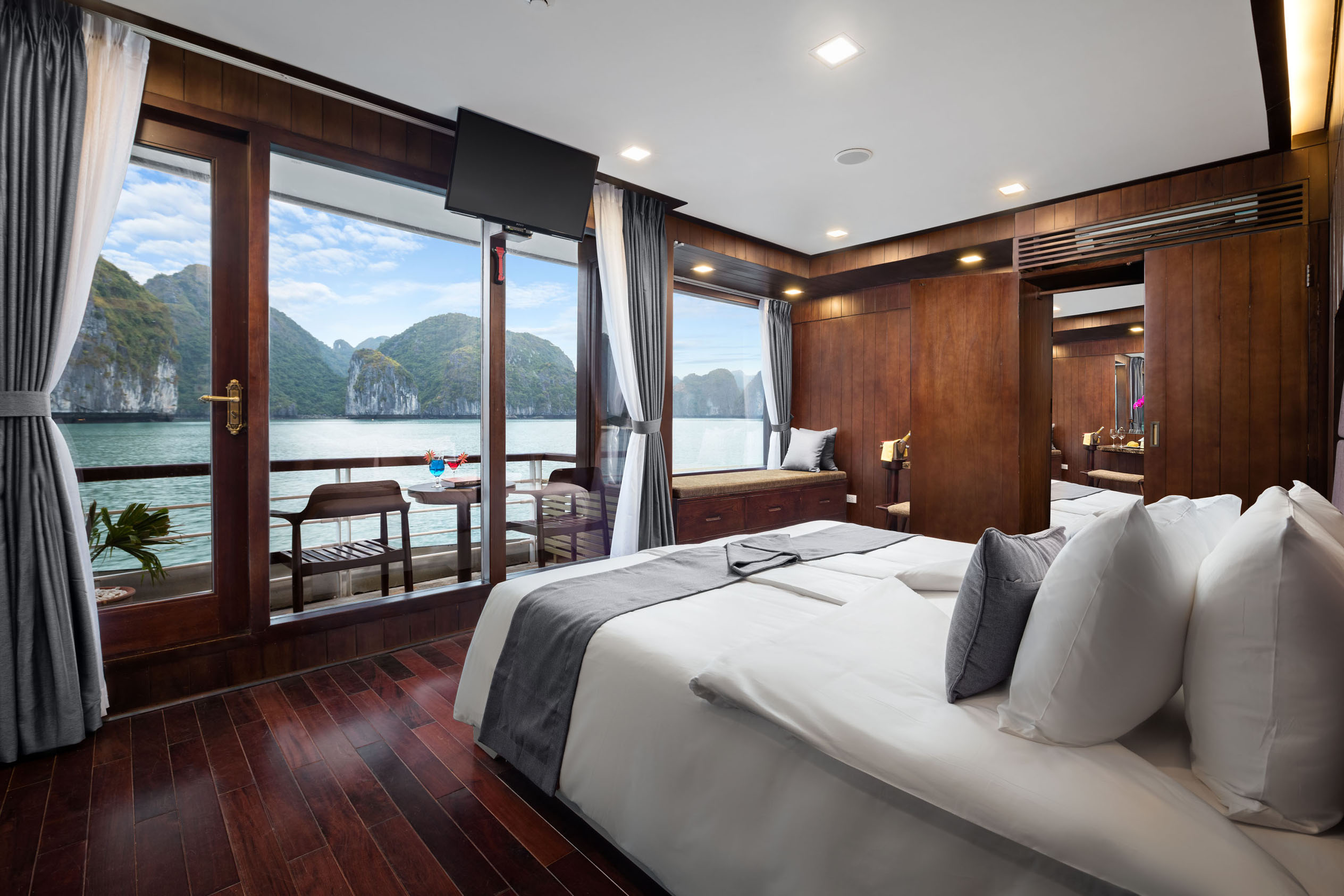 ViettrendTour luxury hotel room with stunning bay views and wooden interior design.