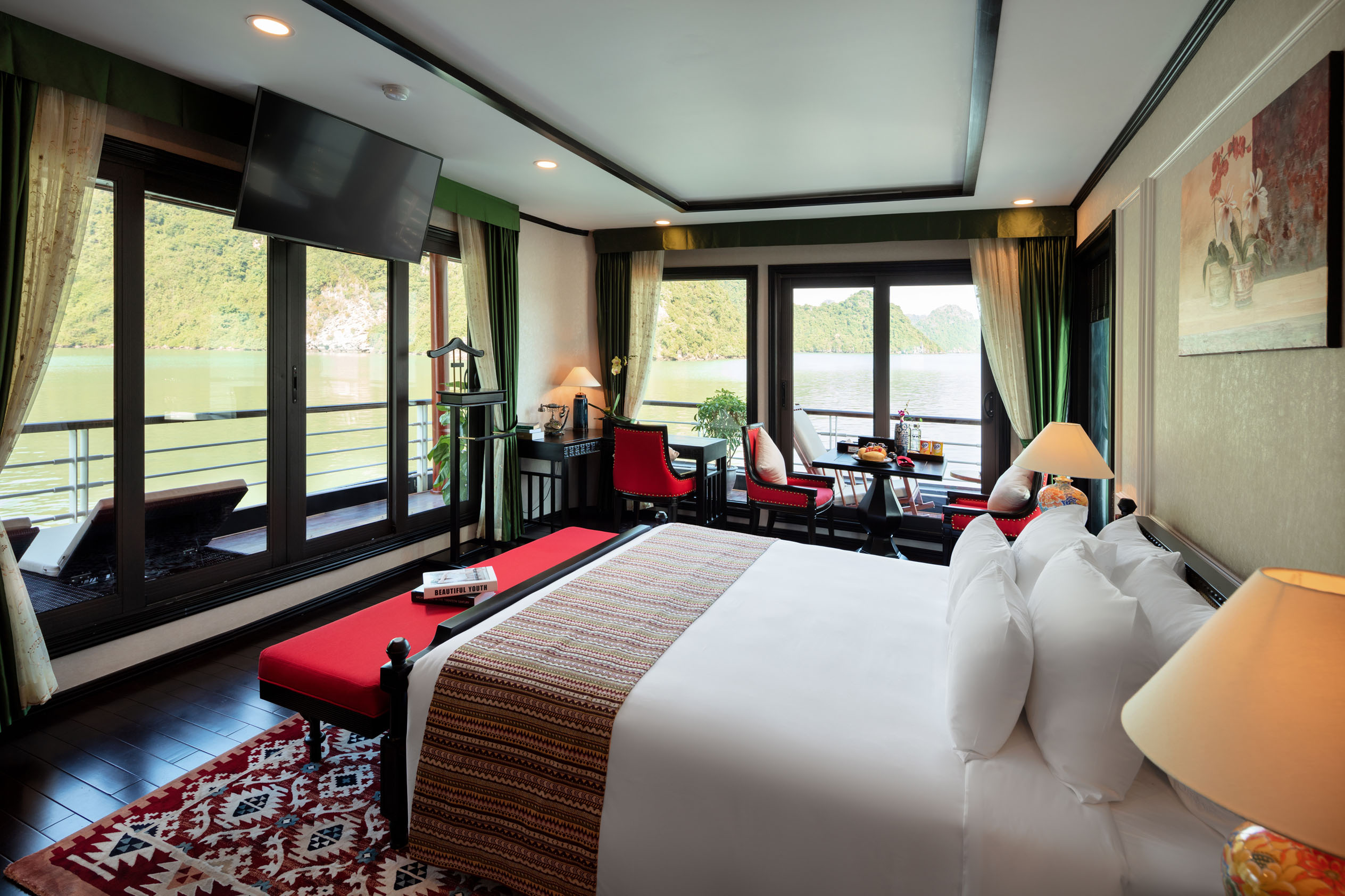 Panoramic river view from a luxurious hotel room with modern decor and elegant furnishings.