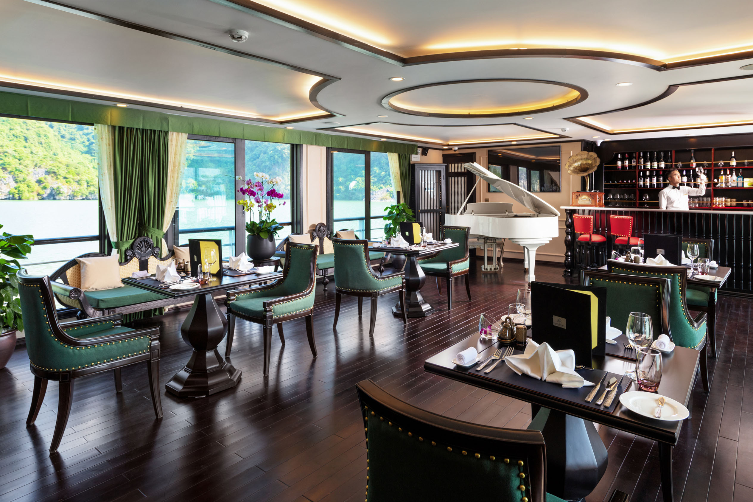 Elegant lakeside restaurant interior with luxurious decor, piano, and bar, perfect for exclusive dining experiences.
