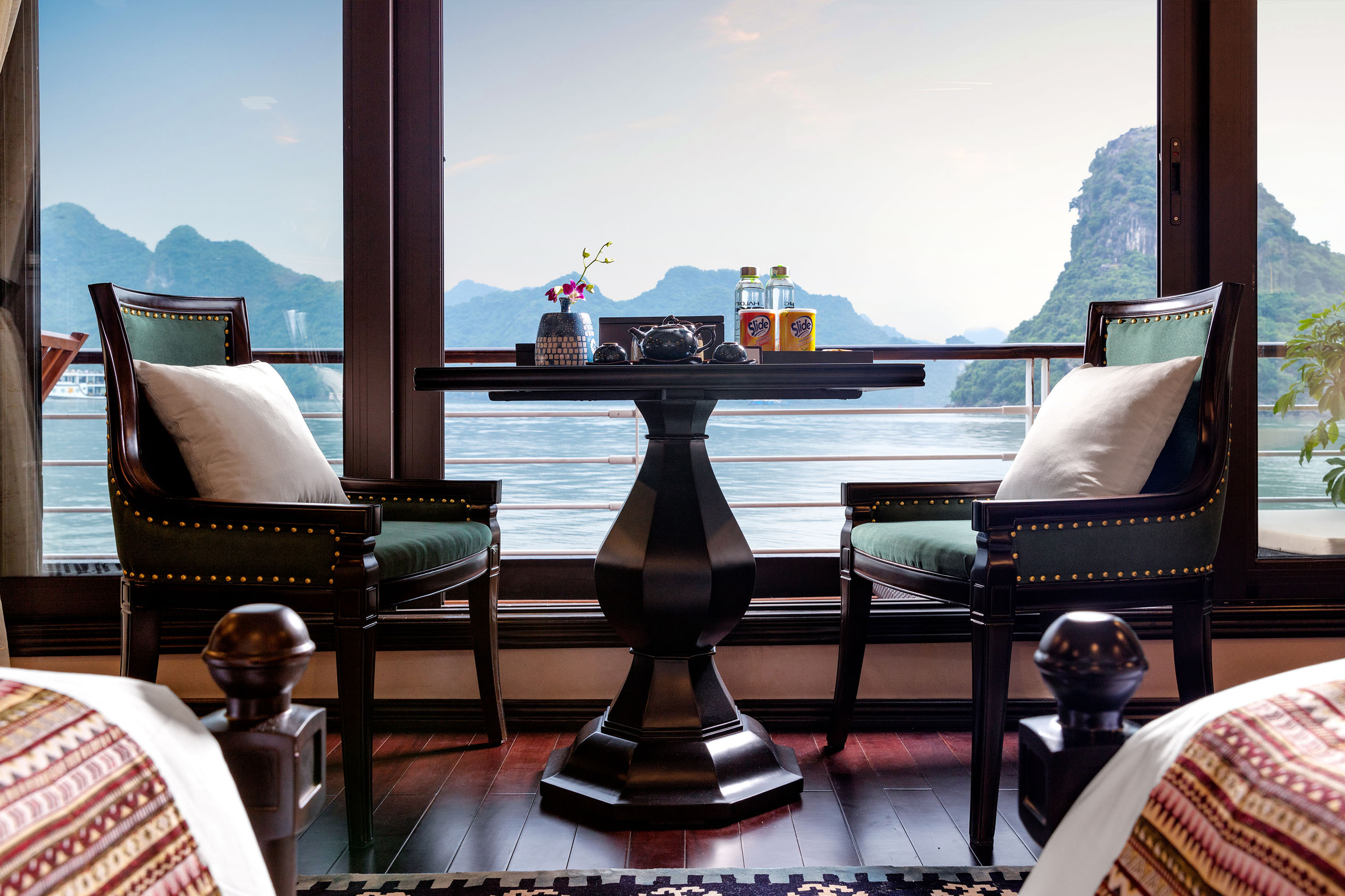 Stunning view of limestone karsts from a luxury boat cabin in Vietnam.