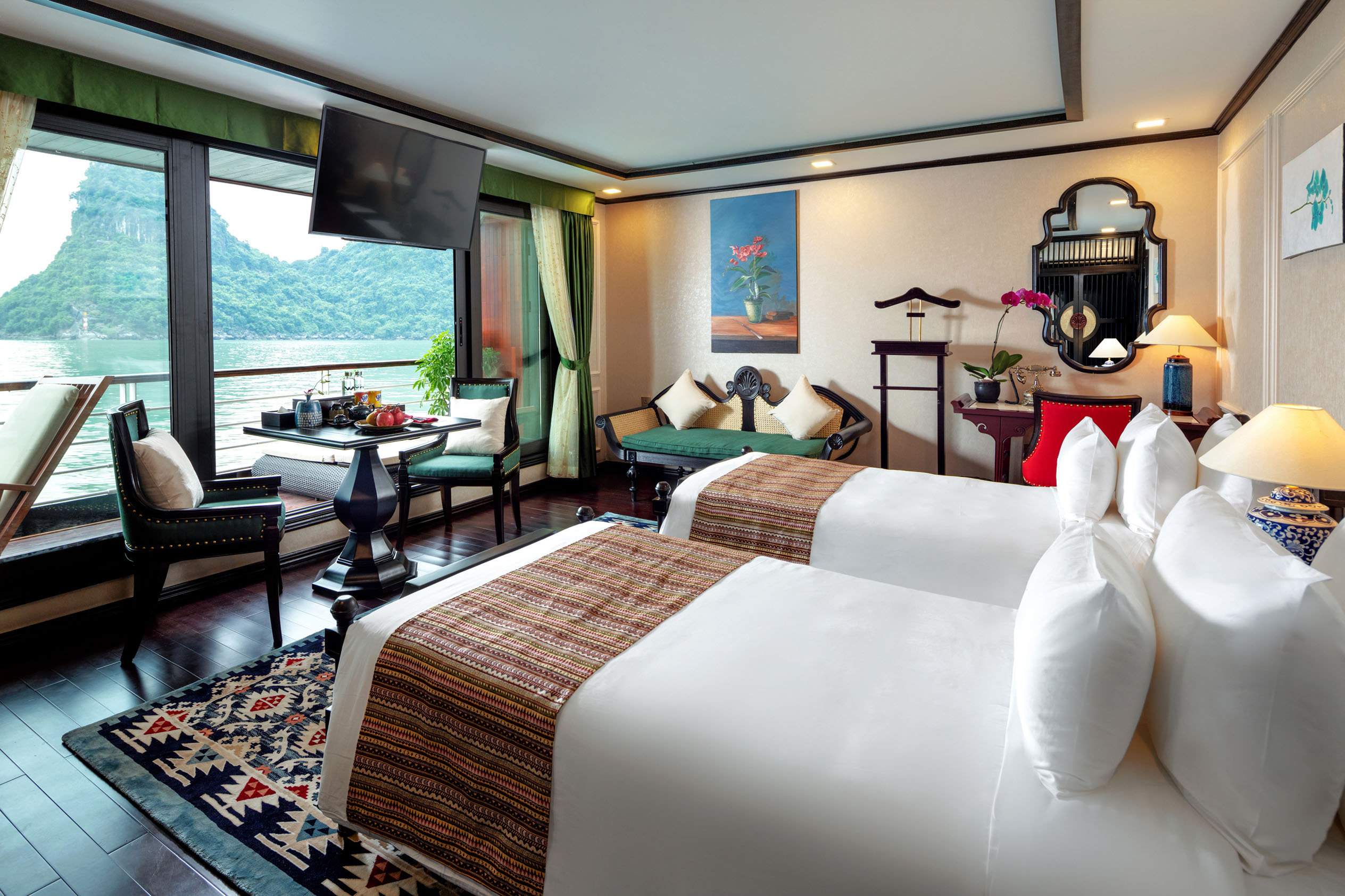 Luxurious hotel room overlooking scenic water view with elegant decor and modern amenities.