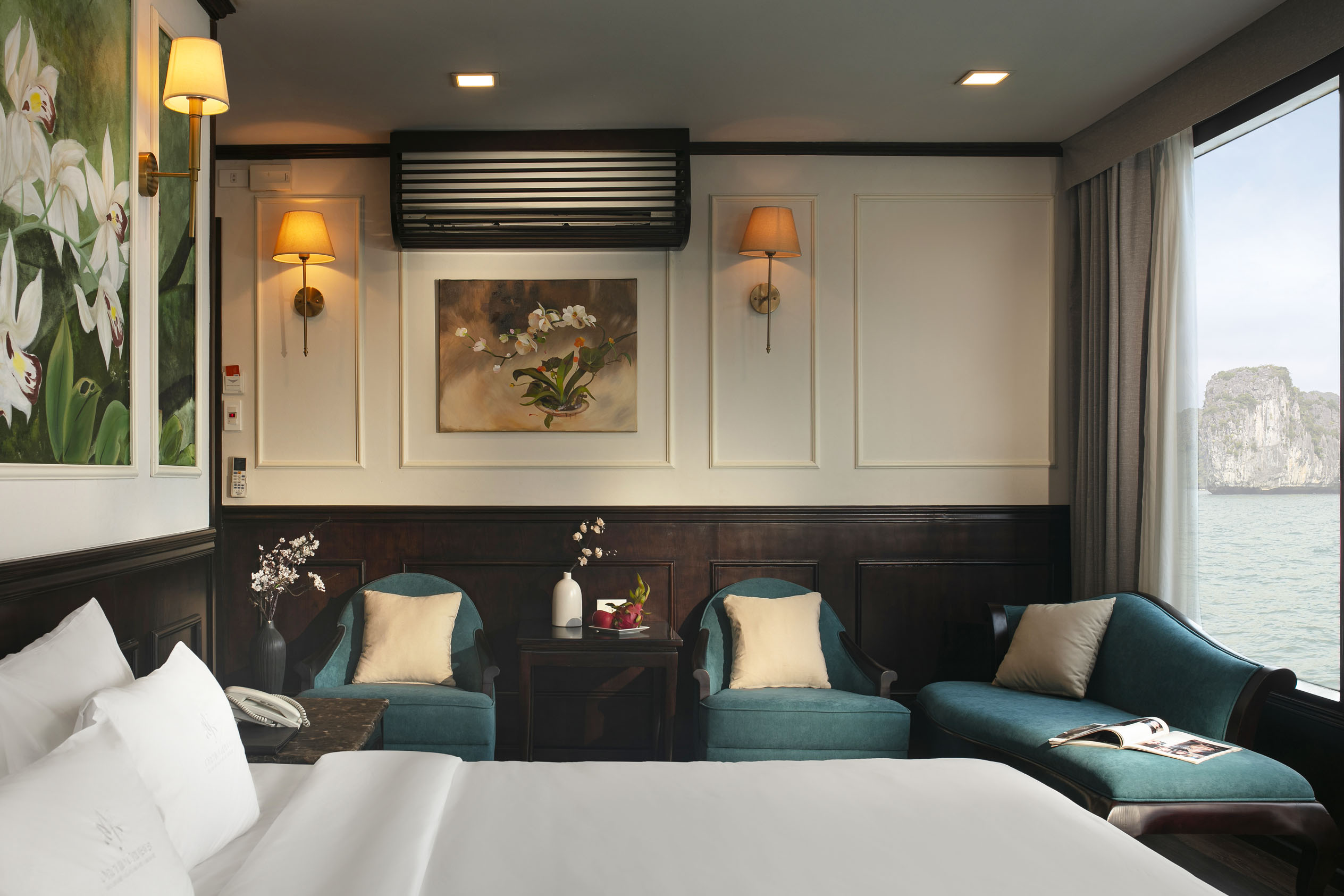 Cozy hotel room with elegant decor, city view, and comfortable seating for relaxing stays.