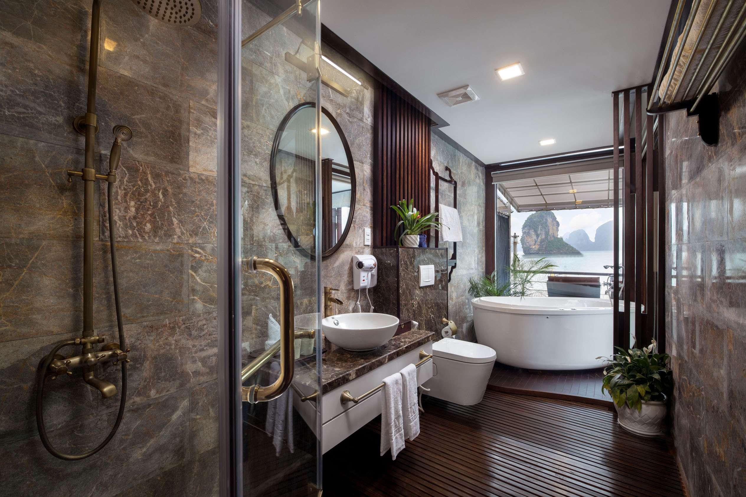Luxurious bathroom with sea view, modern bathtub, and elegant decor at Viettrend Tour resort.