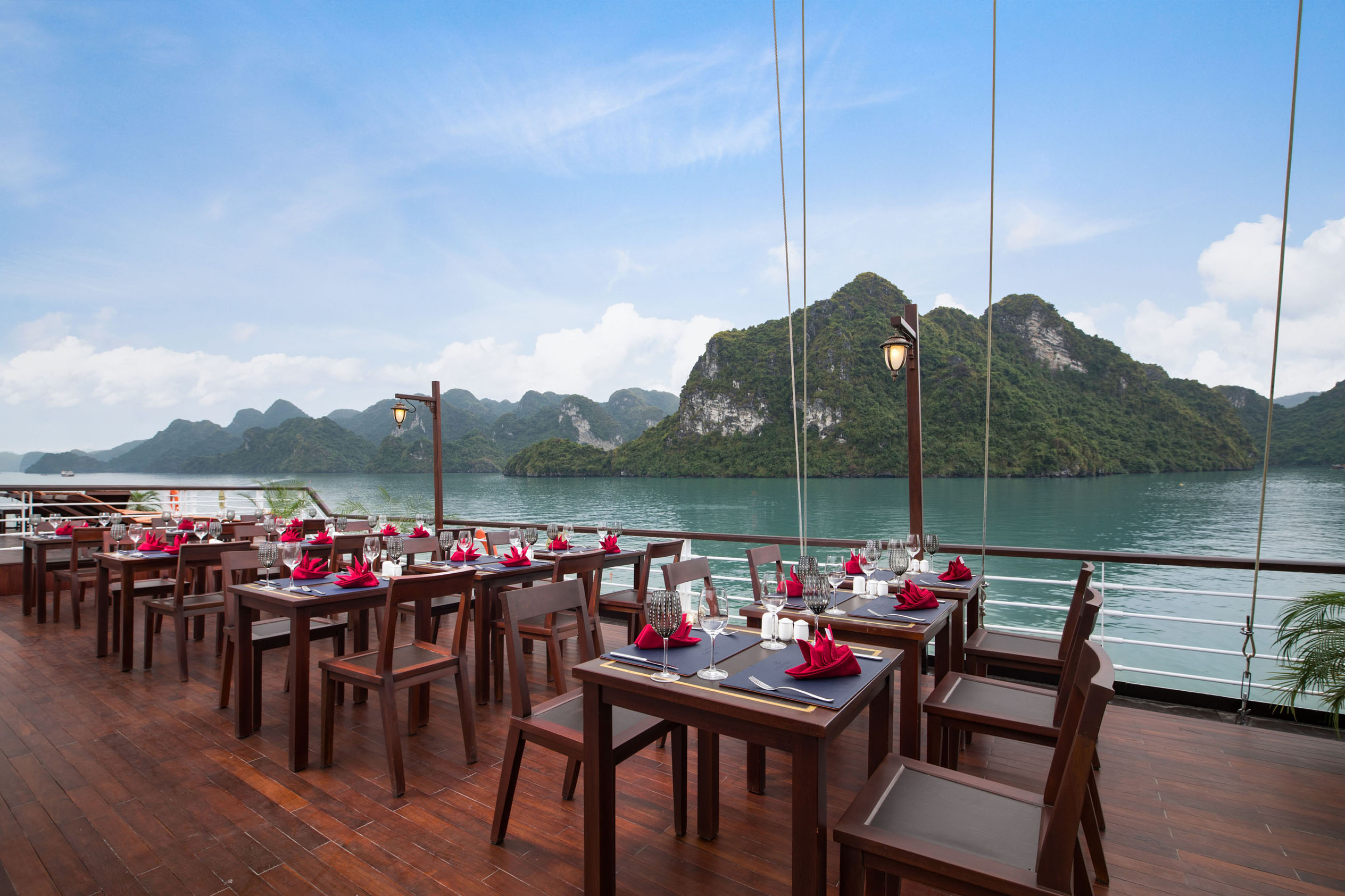 Elegant waterfront restaurant with mountain views in Vietnam, ideal for luxury dining and sightseeing.