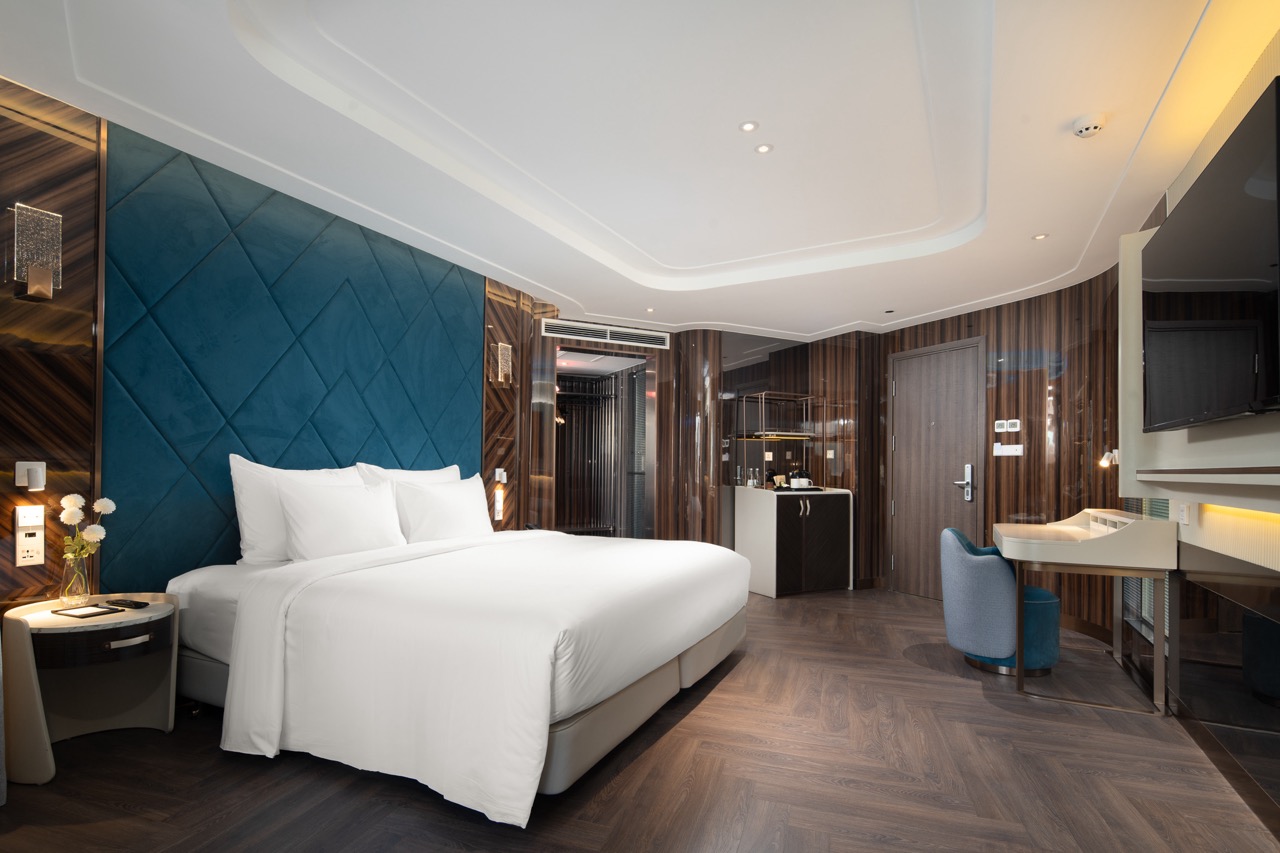 Luxurious hotel room with modern decor and comfortable bedding in Vietnam.