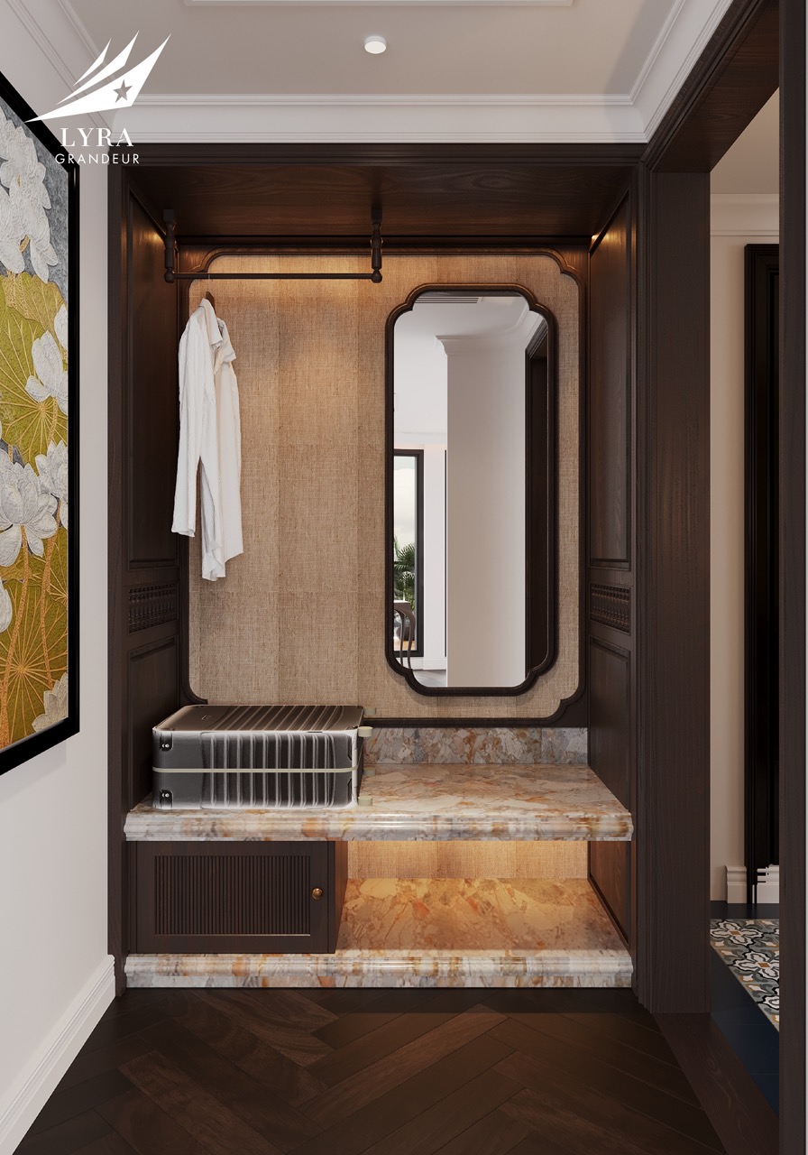 Luxurious hotel foyer with marble accents, elegant mirror, and wooden cabinetry for upscale travel experience.