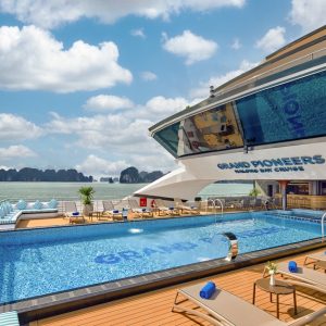 Luxurious yacht with rooftop pool and sea view, perfect for Vietnam cruise vacations.