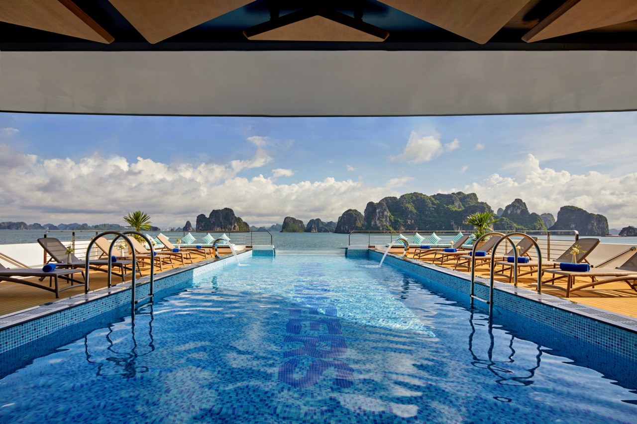Luxurious rooftop infinity pool with sea view and island scenery in Vietnam.