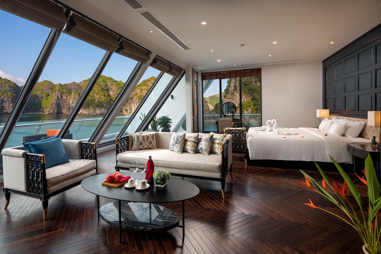 Luxury hotel room with panoramic ocean views and modern decor, perfect for a relaxing getaway.