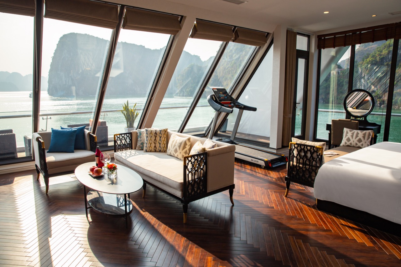 Luxury cruise suite with panoramic ocean views and modern amenities.