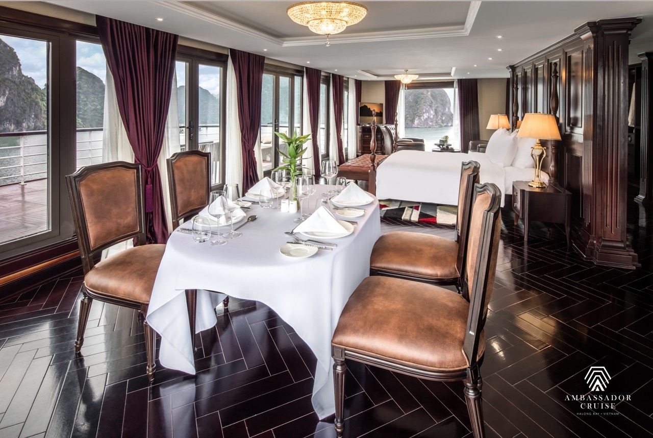 Spacious cruise balcony overlooking Halong Bay's stunning limestone karsts, perfect for relaxing and.