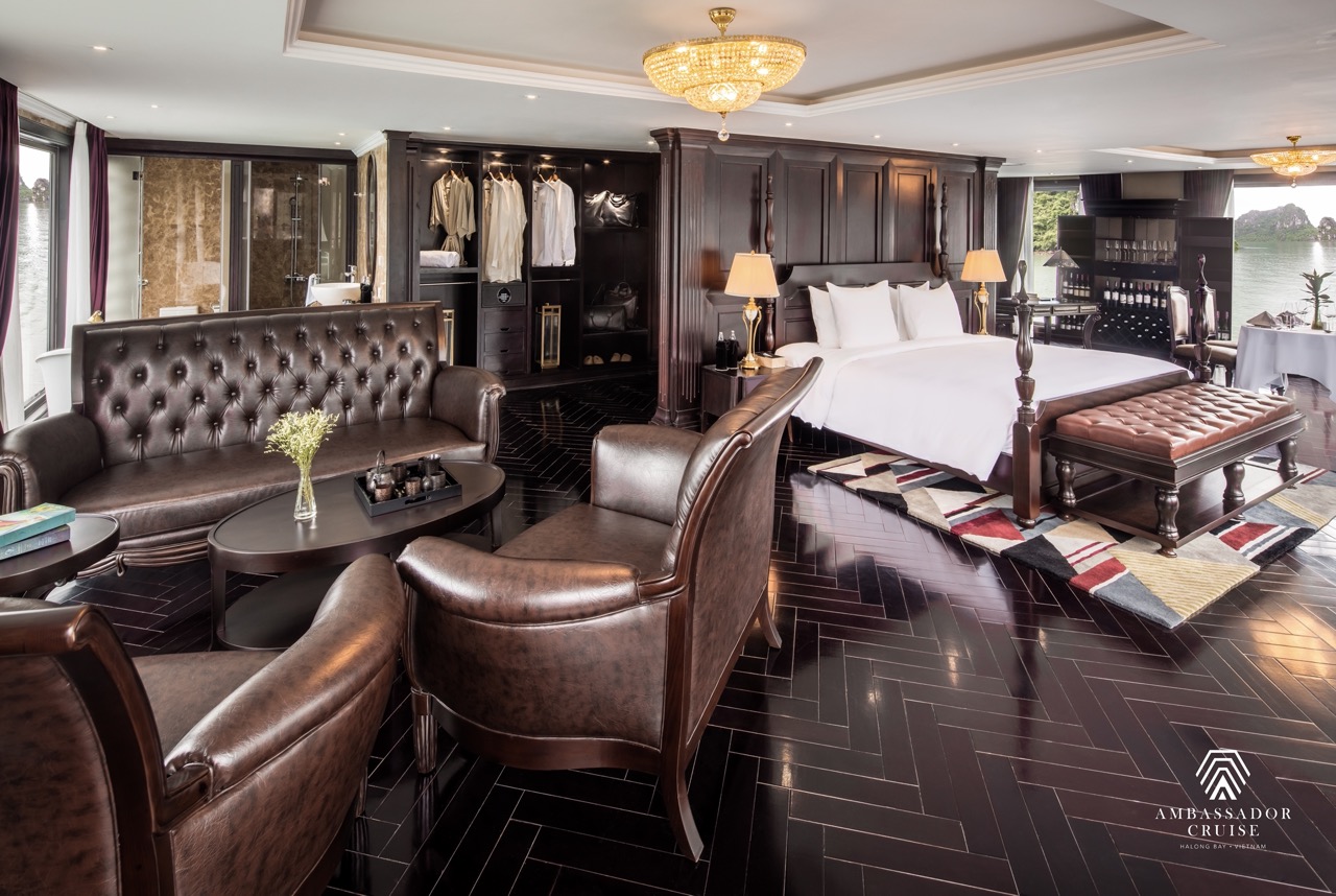 Elegant cruise suite with spacious bed and stylish decor on Halong Bay.