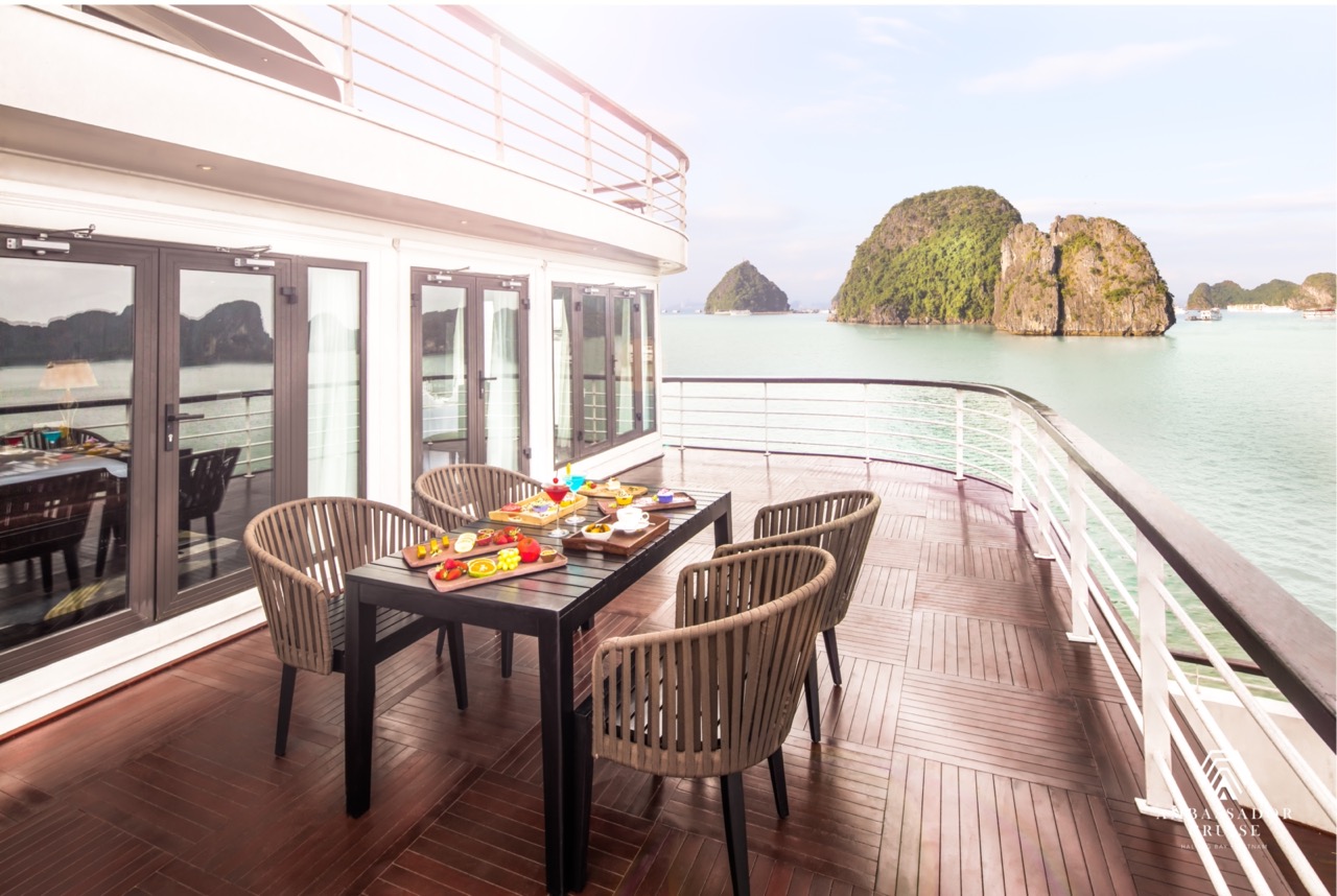 Stunning view from a cruise balcony in Halong Bay with lush islands and calm waters, perfect for a l.