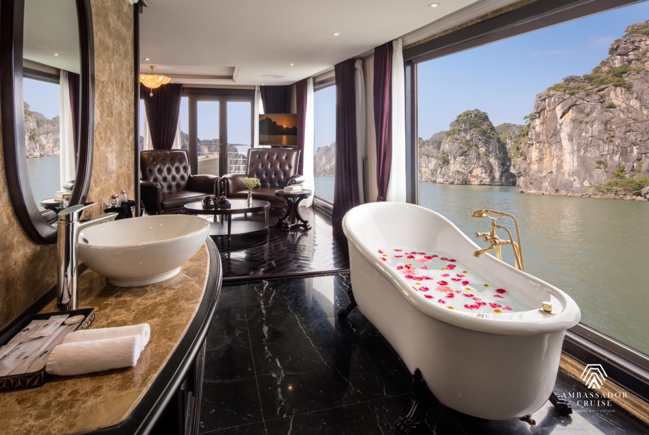 Elegant cruise balcony view of Halong Bay with limestone karsts and calm waters, perfect for a roman.