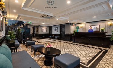 An elegant cruise lounge on Halong Bay featuring stylish seating and sophisticated decor, perfect fo.