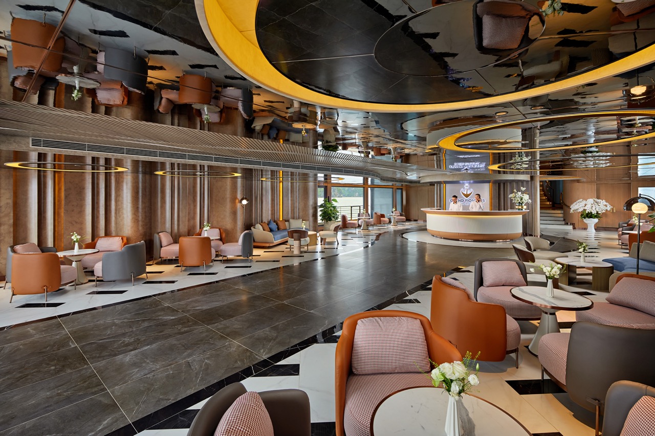 Elegant hotel lobby with stylish seating, modern decor, and a welcoming reception area.