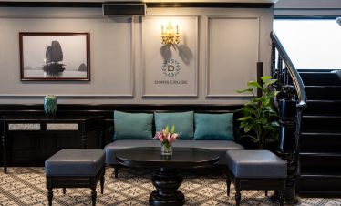 Luxurious cruise lounge with elegant decor and comfortable seating on Doris Cruise in Halong Bay.