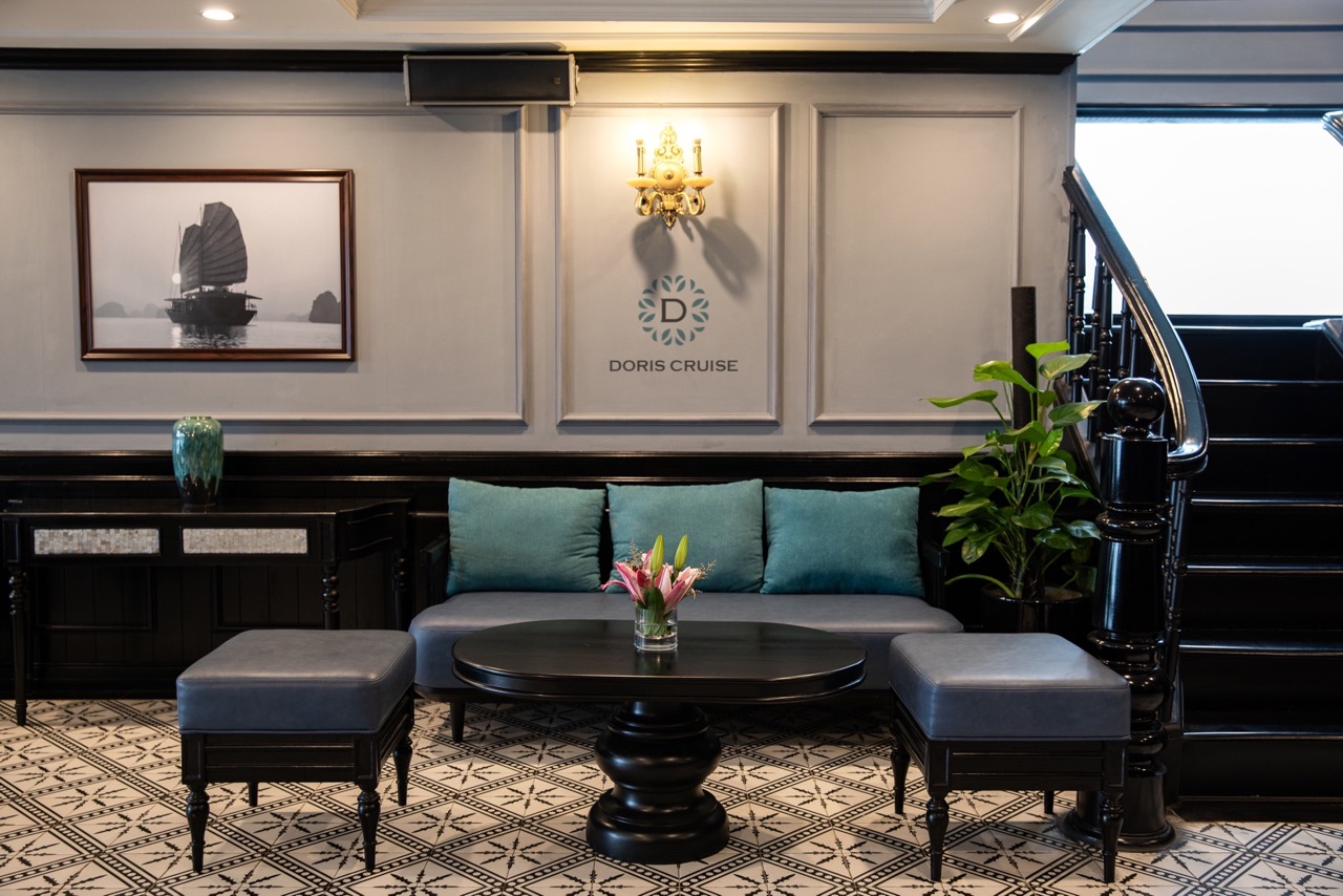 Luxurious cruise lounge with elegant decor and comfortable seating on Doris Cruise in Halong Bay.