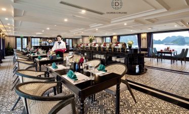 Luxurious cruise balcony overlooking Halong Bay with calm waters and lush islands, perfect for relax.