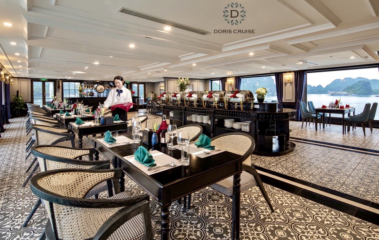 Luxurious cruise balcony overlooking Halong Bay with calm waters and lush islands, perfect for relax.