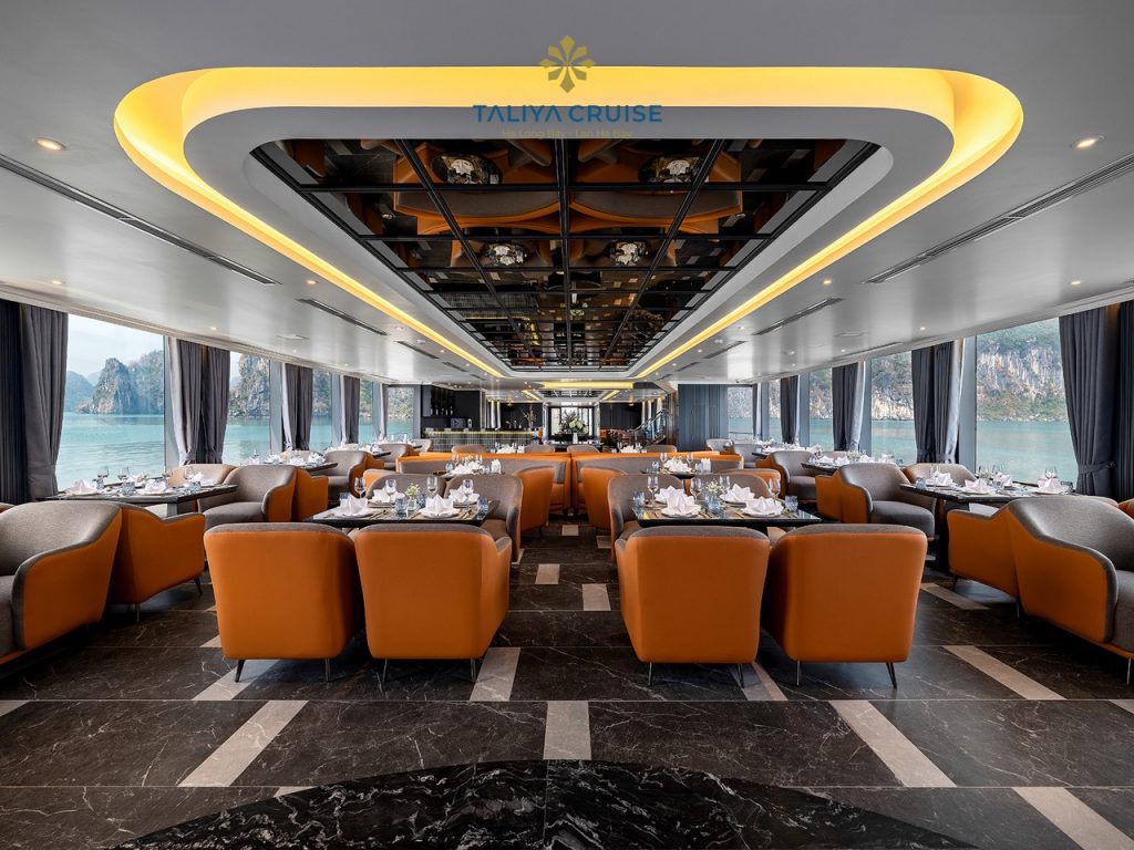 Luxurious cruise lounge with panoramic views of Halong Bay, elegant interior, perfect for relaxing d.