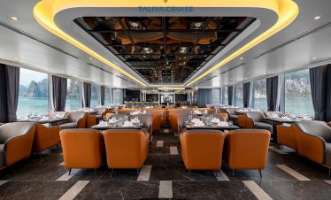 Luxurious cruise lounge with panoramic views of Halong Bay, elegant interior, perfect for relaxing d.